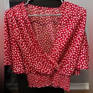 Red and white flowery blouse.